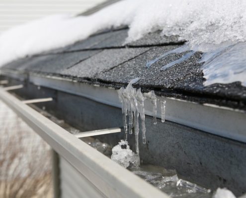 Roof with snow and ice sickles